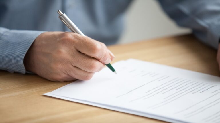 someone writing a letter