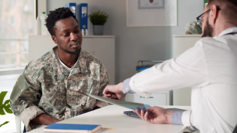 Military servant visiting practitioner in clinic office