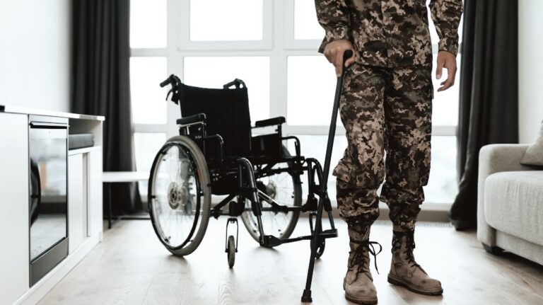 disabled soldier is leaning on a crutch