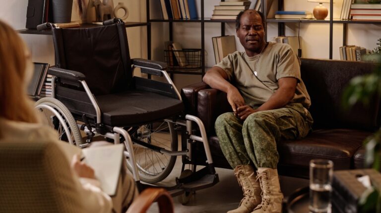 veteran talks to lawyer next to wheelchair