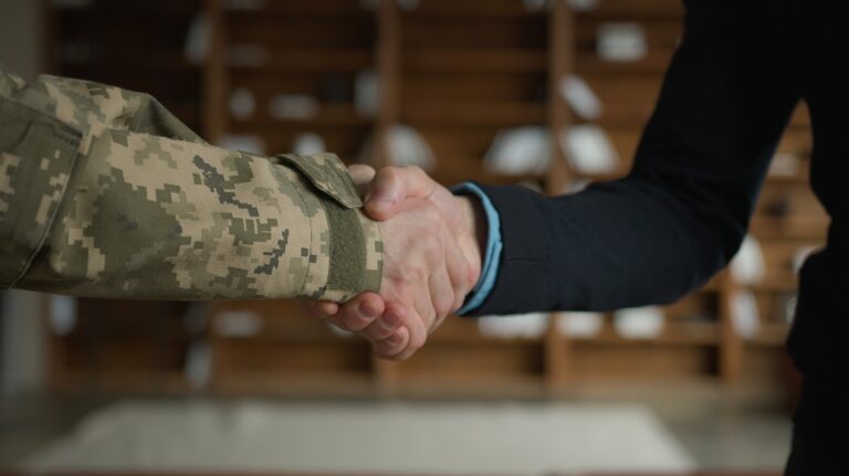 veteran shakes hands with lawyer