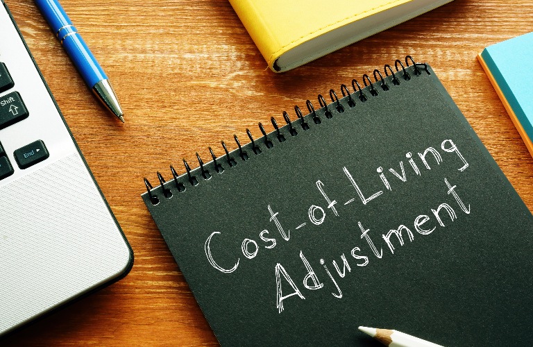 Cost-of-Living Adjustment COLA, laptop and pen