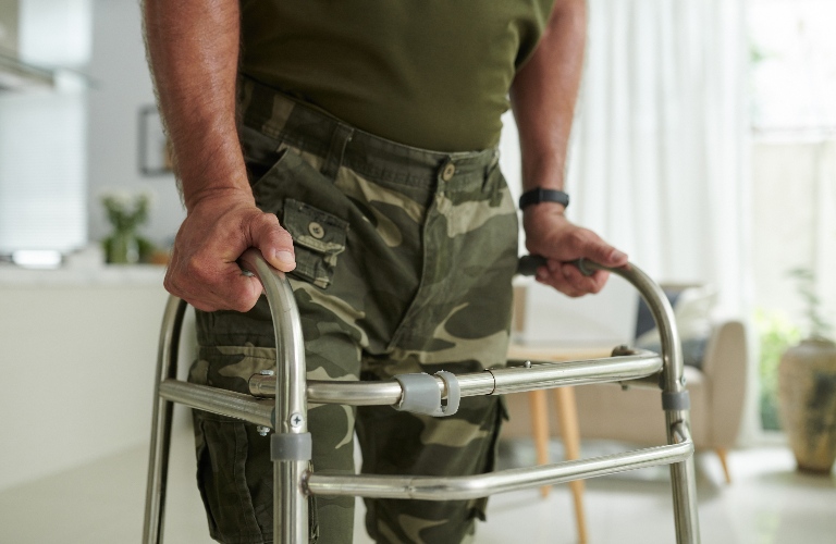 Soldier in Uniform Using Walk Helper