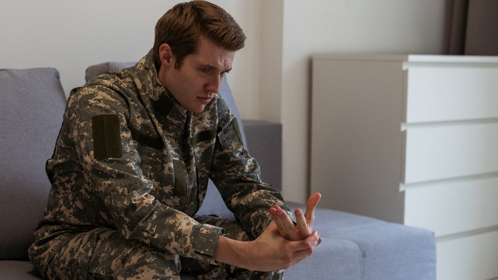 sad, desperate military man looking thoughtful