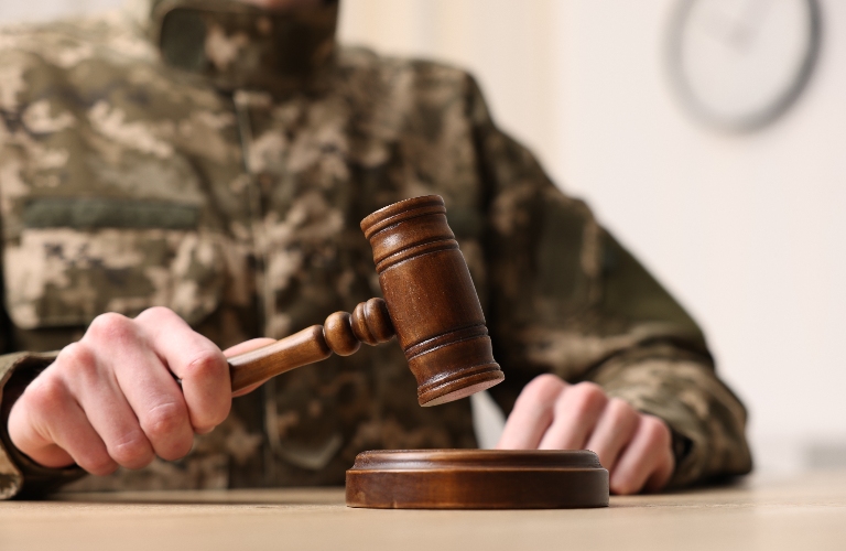 Man in military uniform with gavel