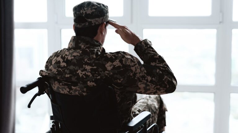 disabled in military uniform sits in a wheelchair
